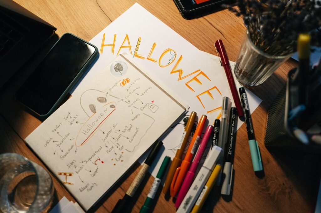 Smoke alarms, a notebook checklist, and a phone reminder on a tidy table