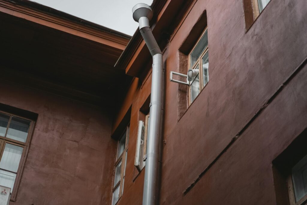 A downspout directing water away from a home’s foundation.