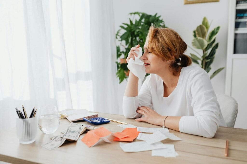 Calculator, receipts, and home safety alarms on a desk