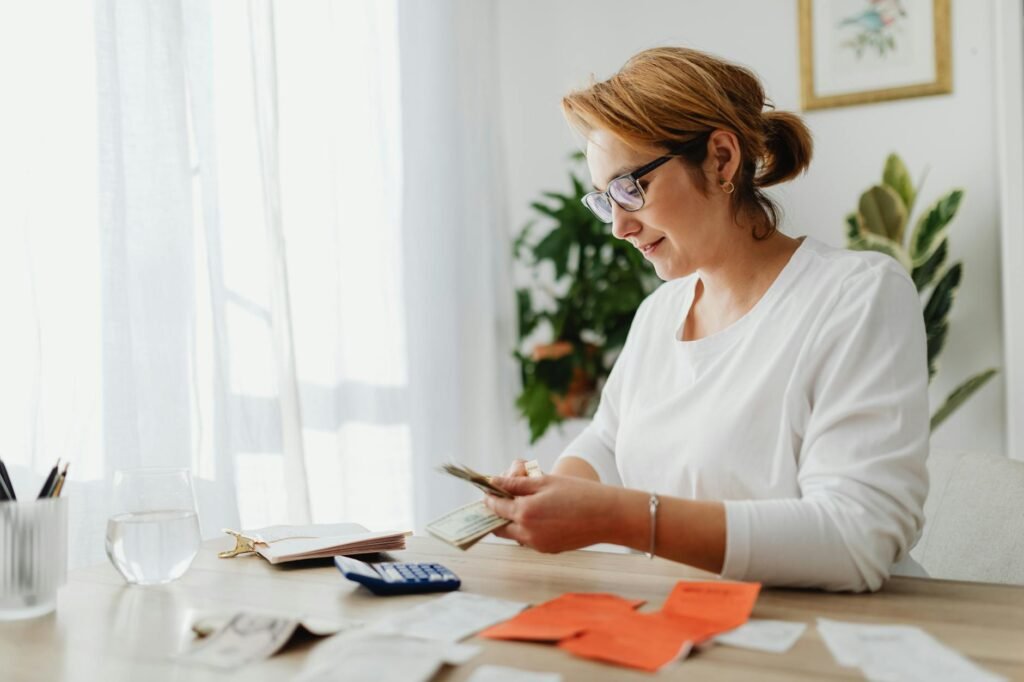 A desk with a calculator, home maintenance notes, and a repair checklist