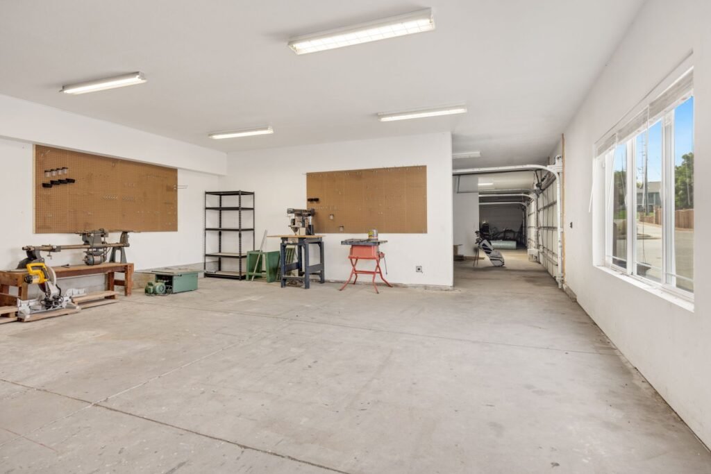 Garage door held halfway open during a manual balance test.